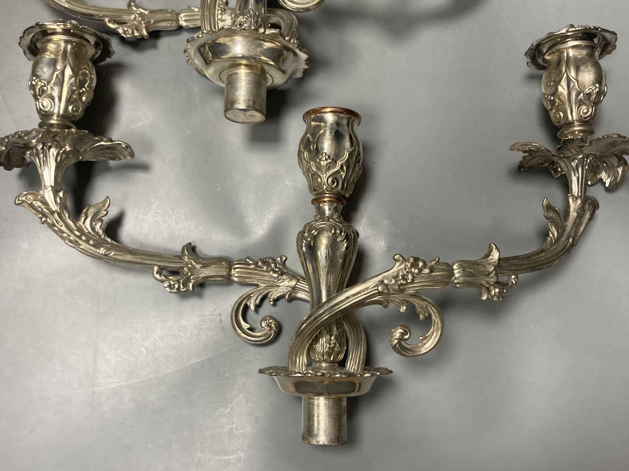 A pair of early Victorian silver candlesticks, indistinct makers mark, Sheffield, 1840, 29cm, weighted (a.f.) & later arms.